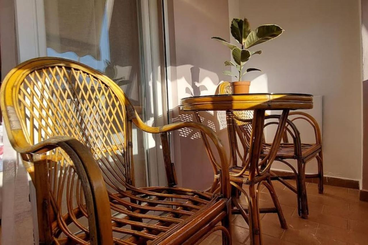 Cozy sunlit apartment with scenic balcony view