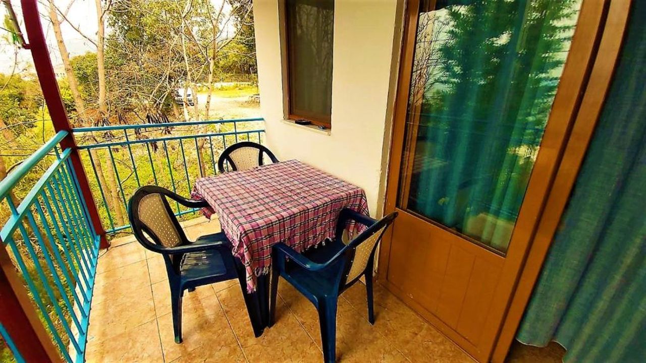 First Room of Cozy Beachside Haven - Panoramic Radhime Retreat with Balcony Dining