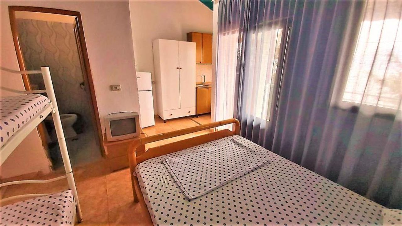 First Room of Cozy Beachside Haven - Panoramic Radhime Retreat with Balcony Dining