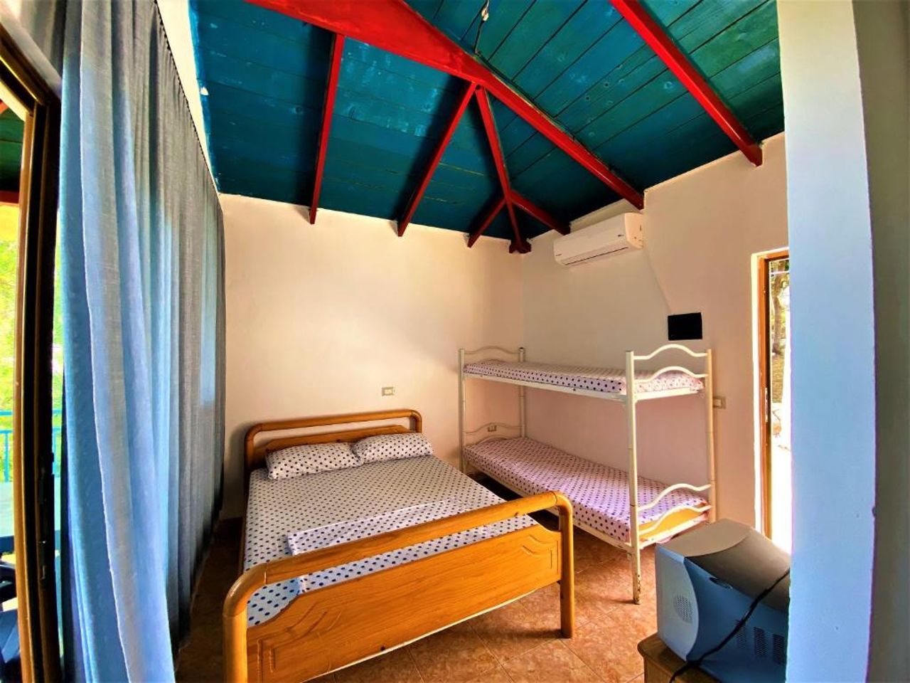 First Room of Cozy Beachside Haven - Panoramic Radhime Retreat with Balcony Dining