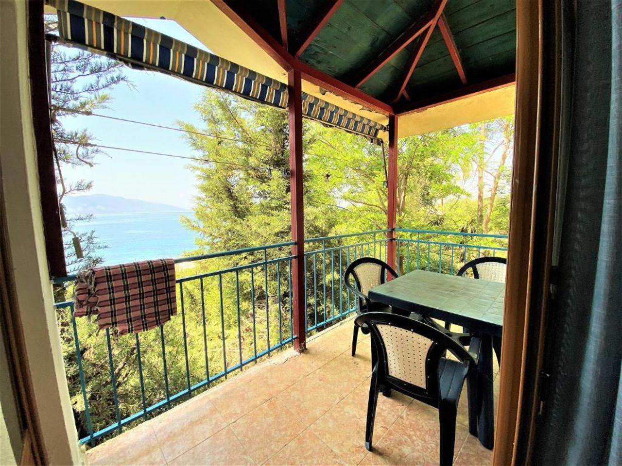 First Room of Cozy Beachside Haven - Panoramic Radhime Retreat with Balcony Dining