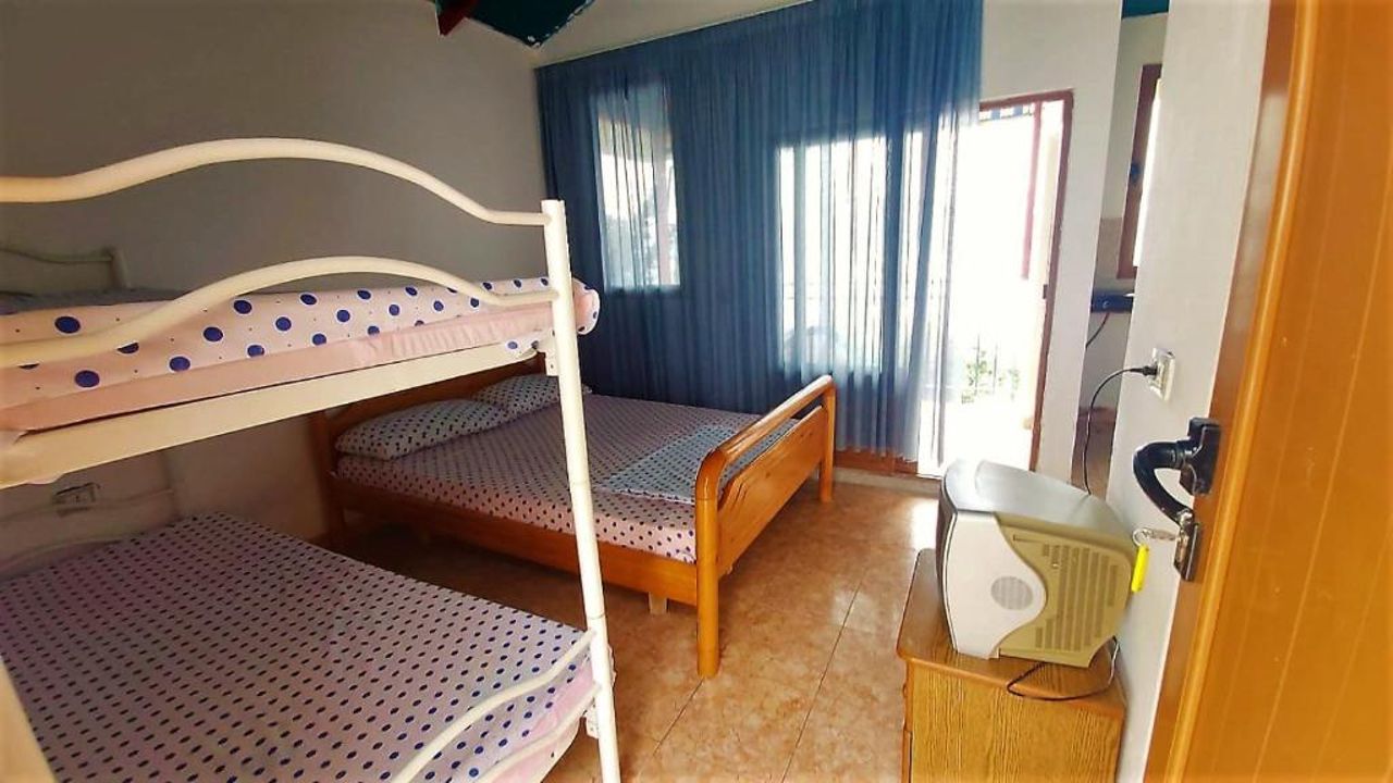 Second Room of Cozy Beachside Haven - Panoramic Radhime Retreat with Balcony Dining