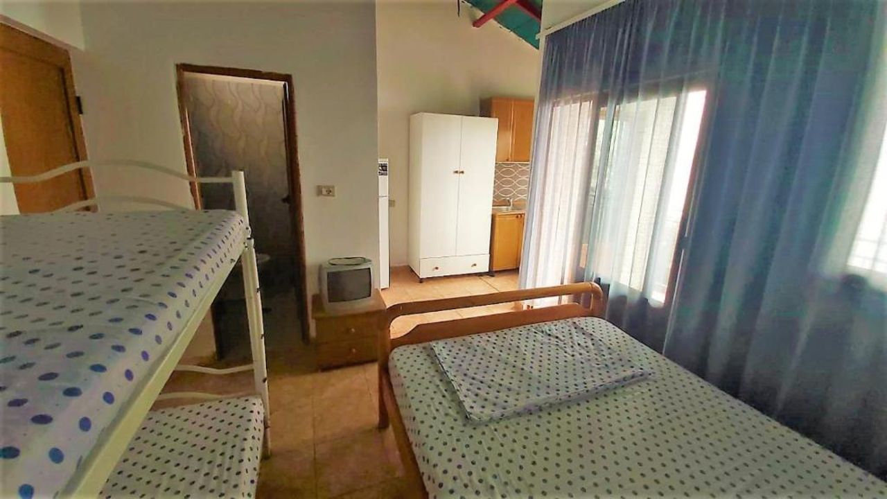 Third Room of Cozy Beachside Haven - Panoramic Radhime Retreat with Balcony Dining