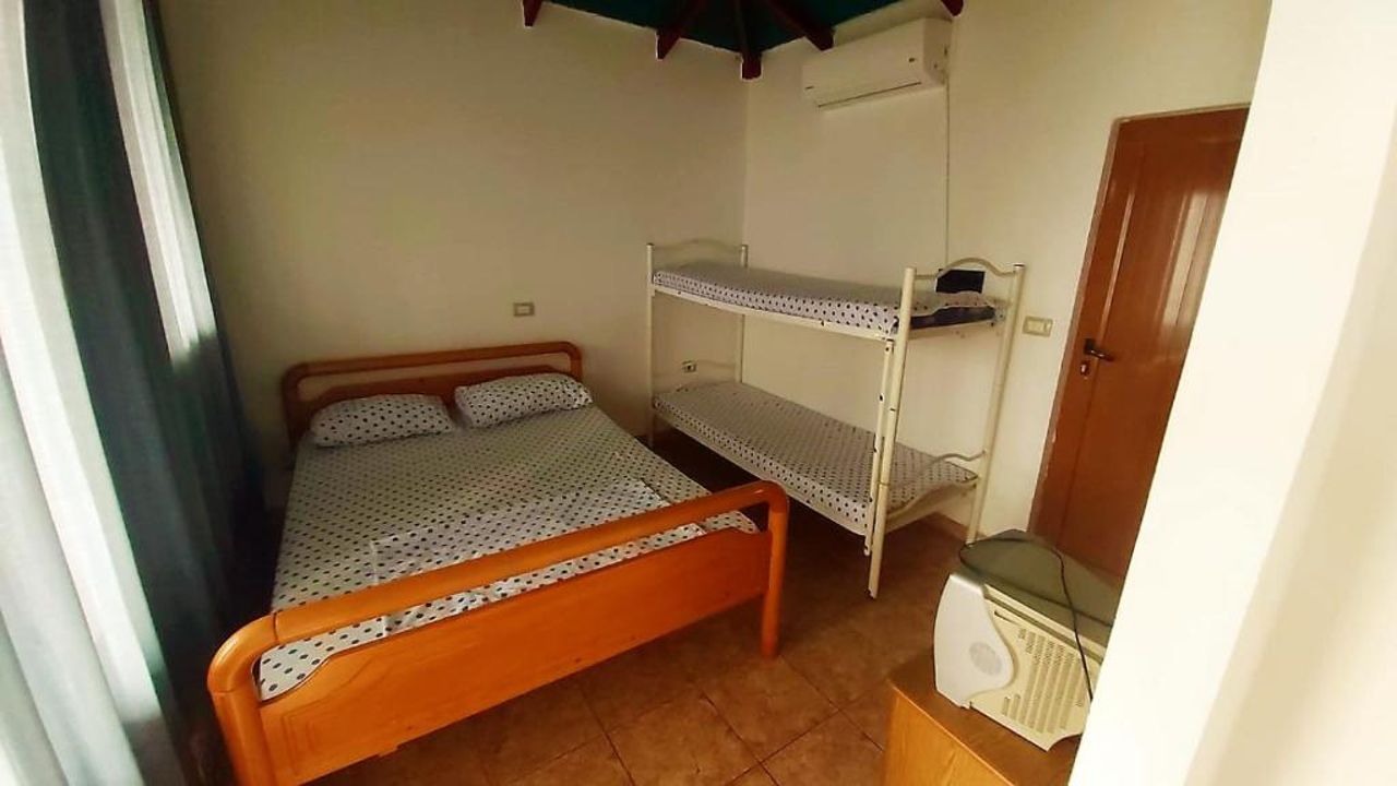 Third Room of Cozy Beachside Haven - Panoramic Radhime Retreat with Balcony Dining