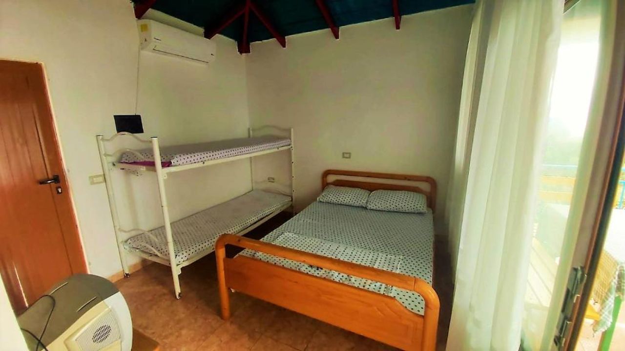 Fourth Room of Cozy Beachside Haven - Panoramic Radhime Retreat with Balcony Dining