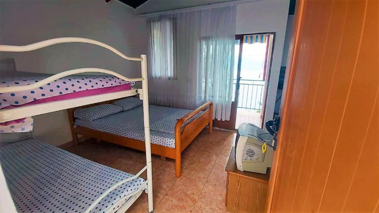 Fourth Room of Cozy Beachside Haven - Panoramic Radhime Retreat with Balcony Dining