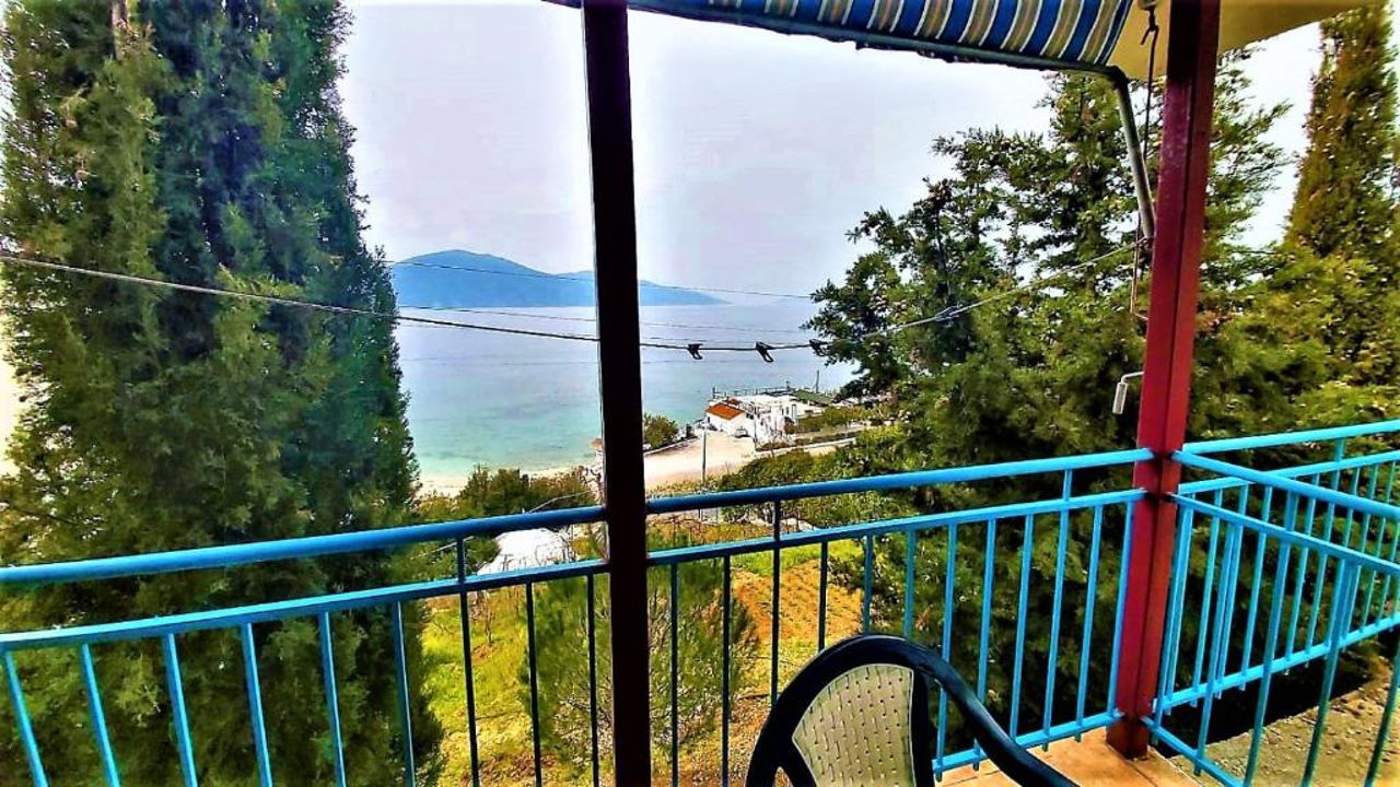 Third Room of Cozy Beachside Haven - Panoramic Radhime Retreat with Balcony Dining
