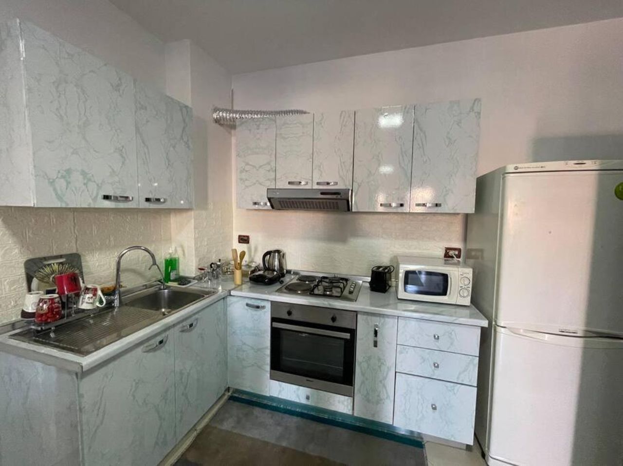Ardit’s apartment.